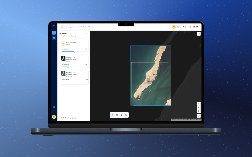 Laptop showing the V52 app's map viewer: a satellite image of a coastline layered over a base map.